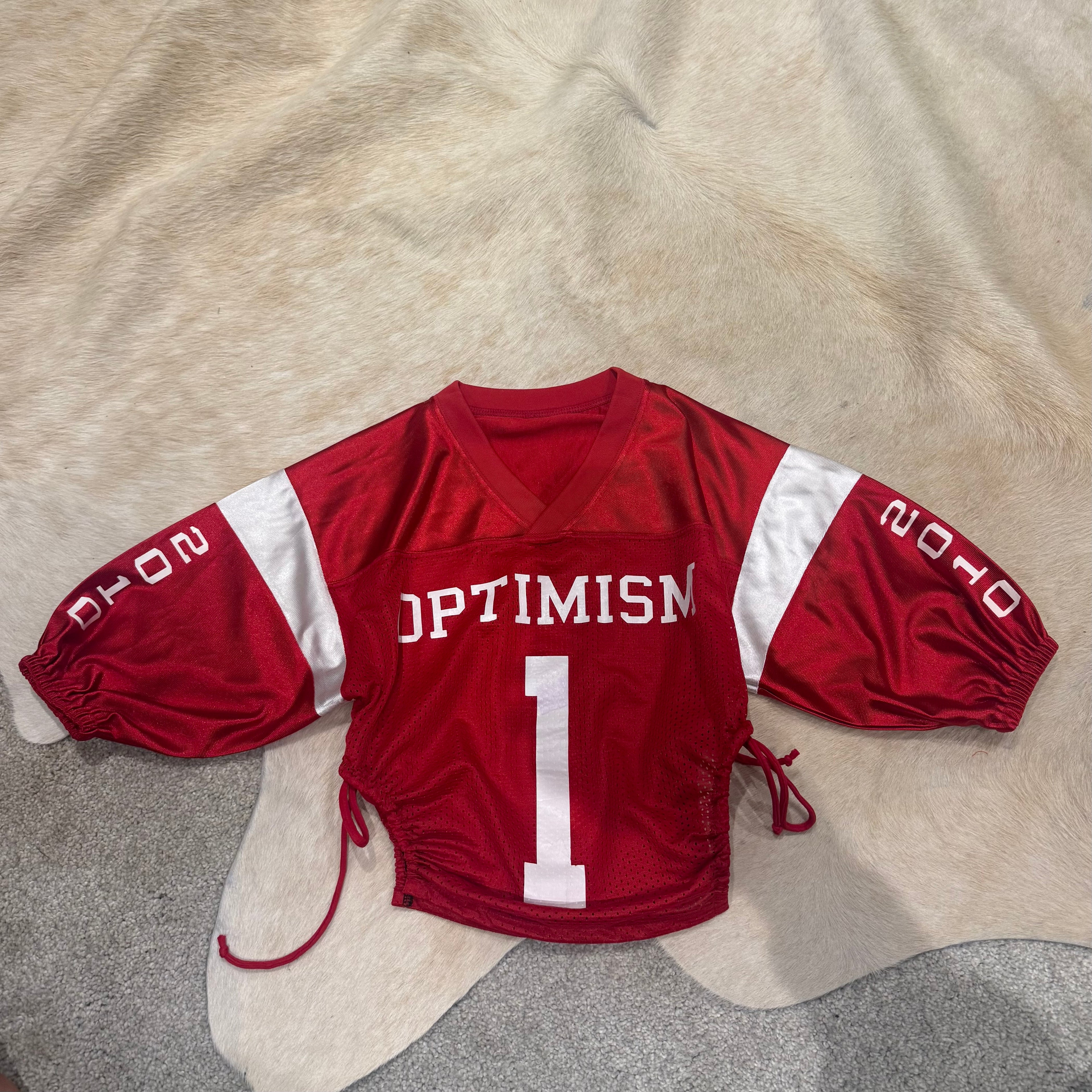 OPTIMISM VARSITY CROP